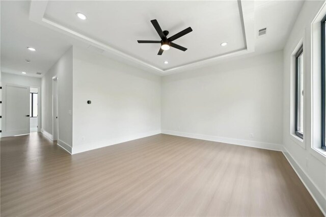 155 Westbrook St, Buford, GA 30518 - unfurnished room featuring a tray ceiling, a ceiling fan, visible vents, wood finished floors, and baseboards