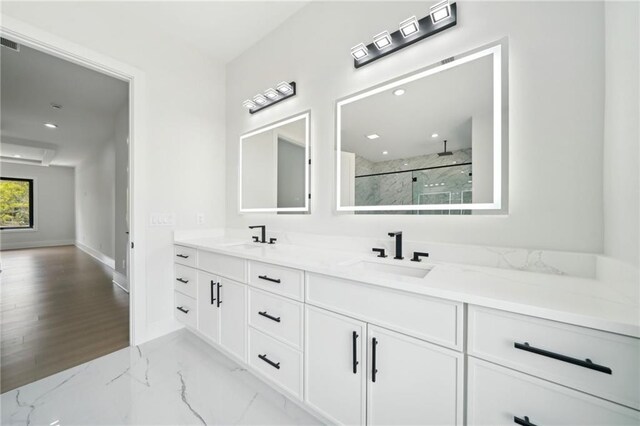 155 Westbrook St, Buford, GA 30518 - full bath featuring a sink, a marble finish shower, double vanity, and marble finish floor