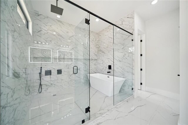 155 Westbrook St, Buford, GA 30518 - bathroom featuring recessed lighting, marble finish floor, a marble finish shower, and a soaking tub
