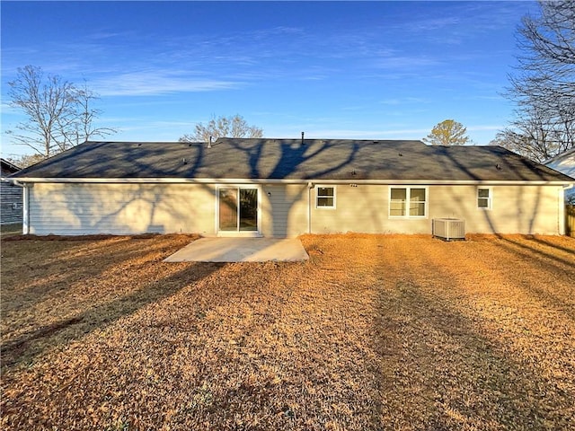 rear view of house featuring a patio and cooling unit