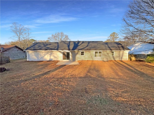 ranch-style home with a patio area and central air condition unit