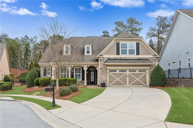 craftsman-style house with a garage and a front yard