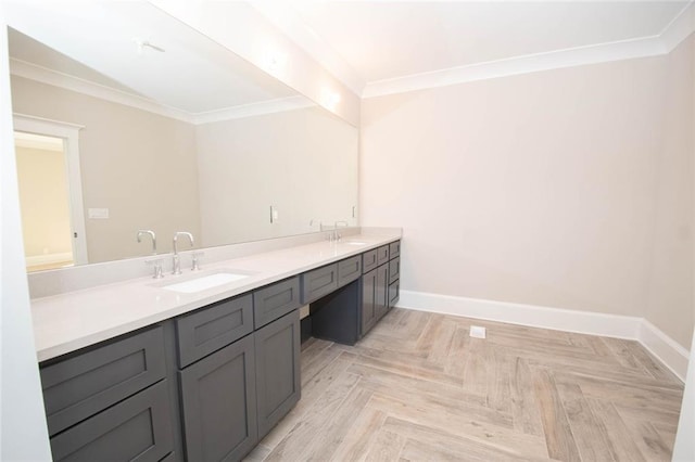 bathroom with parquet flooring, vanity, and ornamental molding