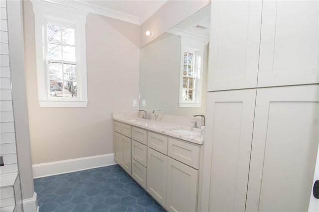 bathroom featuring vanity and ornamental molding