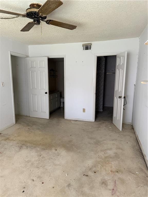 809 Camelot Dr, College Park, GA 30349 - unfurnished bedroom with unfinished concrete floors, a textured ceiling, ceiling fan, and connected bathroom