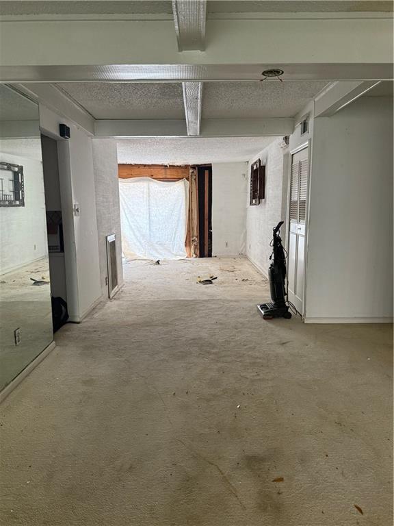 809 Camelot Dr, College Park, GA 30349 - hall with beam ceiling and carpet flooring
