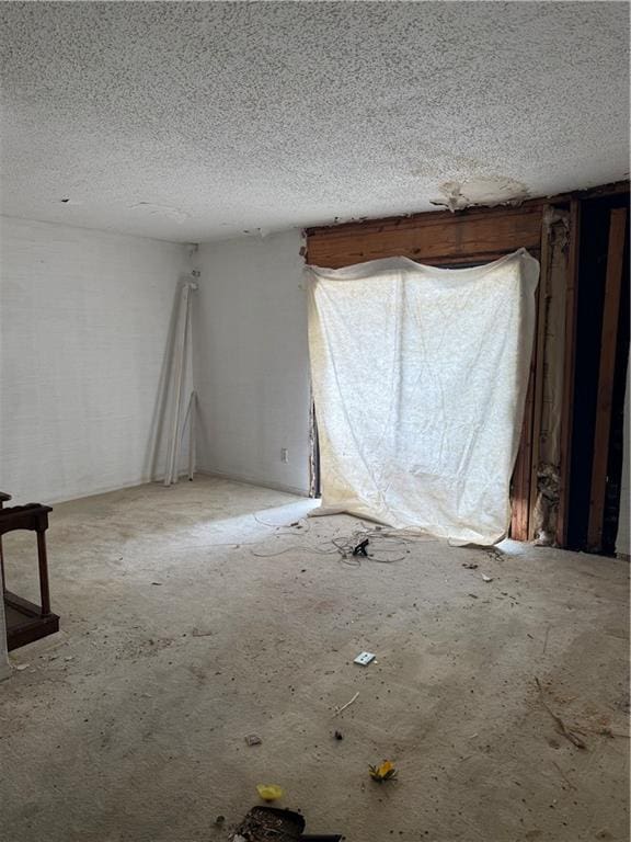 809 Camelot Dr, College Park, GA 30349 - empty room with a textured ceiling