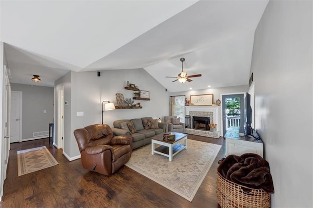 70 Maplewood Ln, Acworth, GA 30101 - living area featuring vaulted ceiling, ceiling fan, a fireplace, and dark wood-type flooring