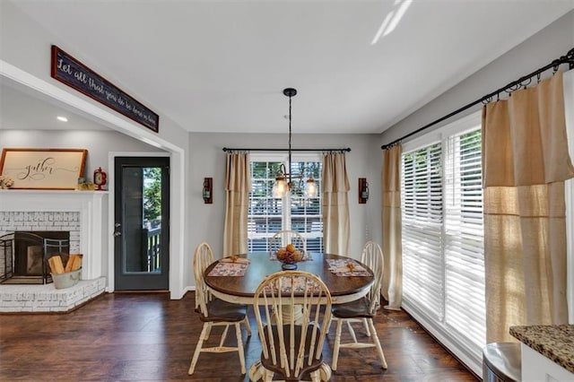 70 Maplewood Ln, Acworth, GA 30101 - dining space featuring plenty of natural light, dark wood finished floors, and a brick fireplace