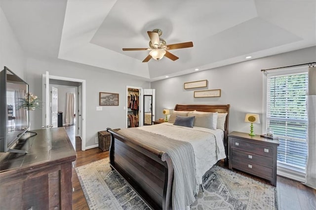 70 Maplewood Ln, Acworth, GA 30101 - bedroom with a tray ceiling, wood finished floors, a spacious closet, ceiling fan, and recessed lighting