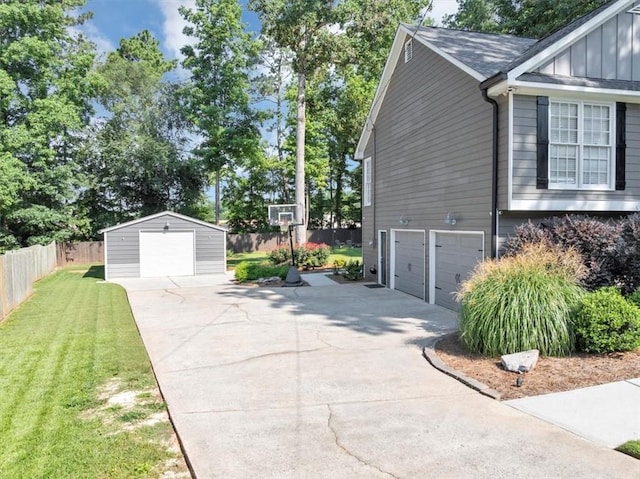 70 Maplewood Ln, Acworth, GA 30101 - view of home's exterior featuring concrete driveway, board and batten siding, and an outbuilding