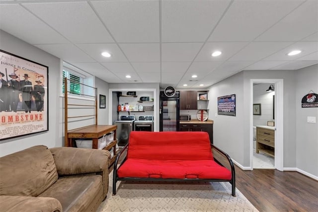 70 Maplewood Ln, Acworth, GA 30101 - living area featuring dark wood-style flooring, washing machine and clothes dryer, recessed lighting, and a drop ceiling