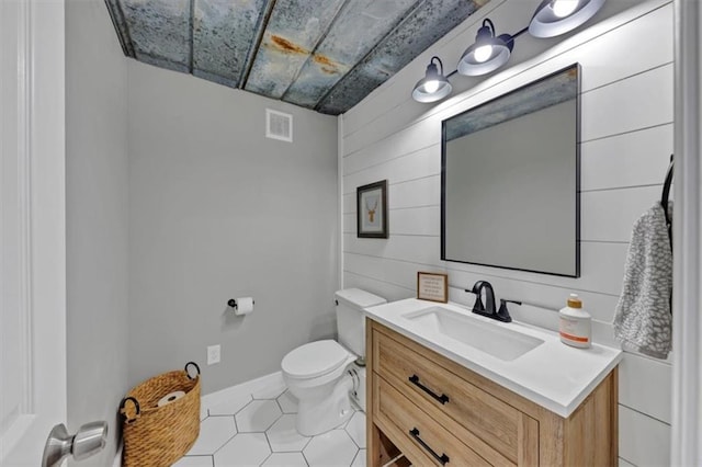 70 Maplewood Ln, Acworth, GA 30101 - bathroom with vanity, tile patterned flooring, and wooden walls
