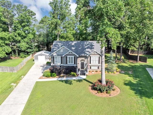 70 Maplewood Ln, Acworth, GA 30101 - view of front facade with a detached garage, driveway, view of wooded area, and an outdoor structure