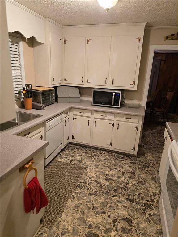 kitchen with sink, a textured ceiling, white cabinets, and white dishwasher