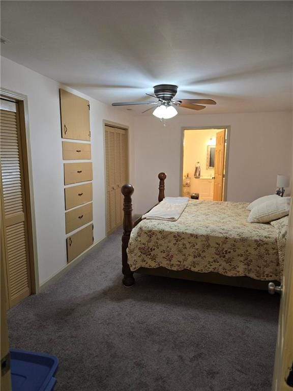 carpeted bedroom with multiple closets and ceiling fan