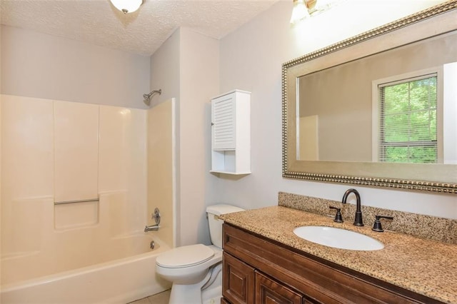 full bathroom with shower / bath combination, toilet, a textured ceiling, and vanity