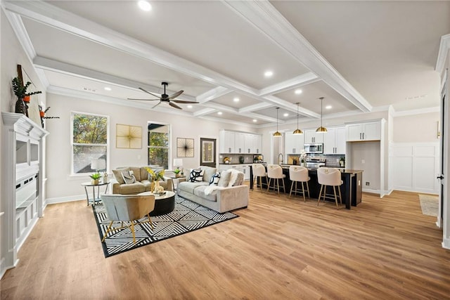 living room with recessed lighting, beamed ceiling, light wood-style floors, and ceiling fan