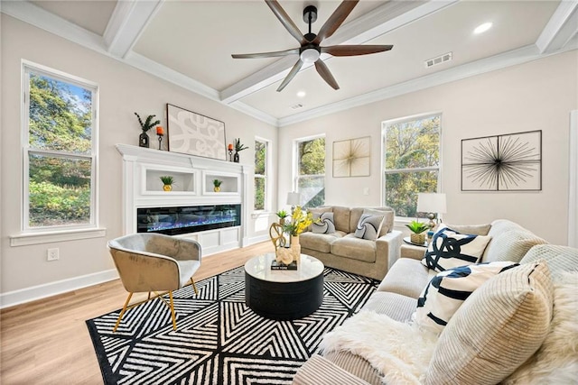 living room featuring visible vents, beamed ceiling, wood finished floors, baseboards, and ceiling fan