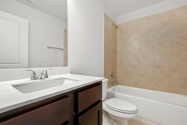 bathroom with vanity, toilet, and shower / washtub combination