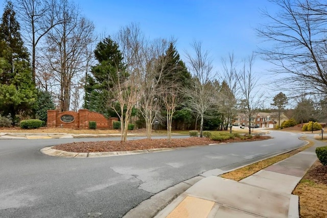 view of street with sidewalks and curbs