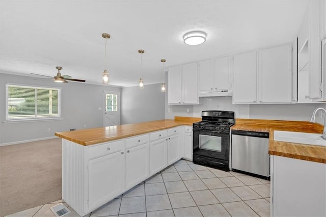 19 Quail Hollow Ct, Dallas, GA 30157 - kitchen featuring gas stove, dishwasher, wood counters, under cabinet range hood, and a peninsula