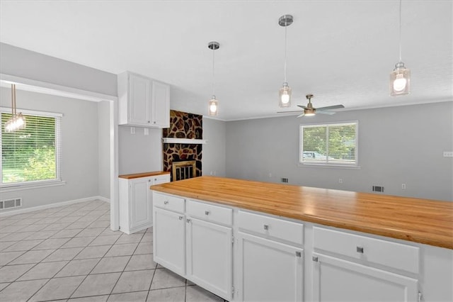 19 Quail Hollow Ct, Dallas, GA 30157 - kitchen featuring ceiling fan, butcher block counters, white cabinetry, and light tile patterned floors