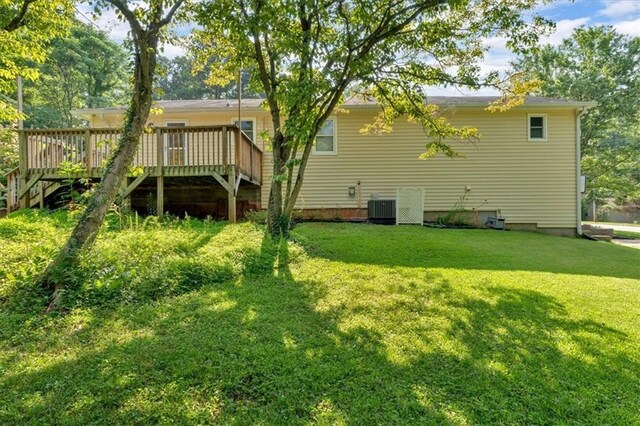 19 Quail Hollow Ct, Dallas, GA 30157 - rear view of house featuring a wooden deck, central air condition unit, and a yard