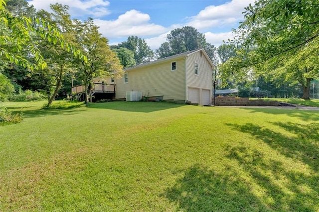 19 Quail Hollow Ct, Dallas, GA 30157 - back of property with an attached garage, a yard, and view of scattered trees
