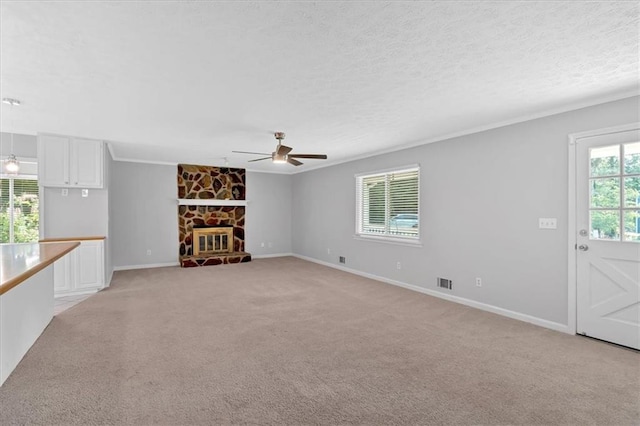 19 Quail Hollow Ct, Dallas, GA 30157 - unfurnished living room featuring a ceiling fan, light colored carpet, baseboards, ornamental molding, and a textured ceiling