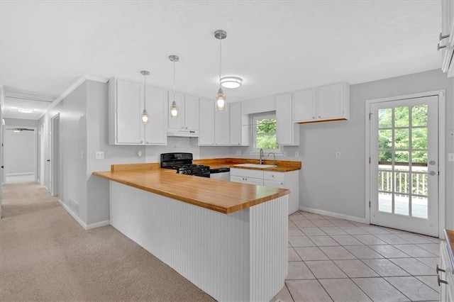 19 Quail Hollow Ct, Dallas, GA 30157 - kitchen featuring black gas range oven, a sink, under cabinet range hood, a peninsula, and white cabinets