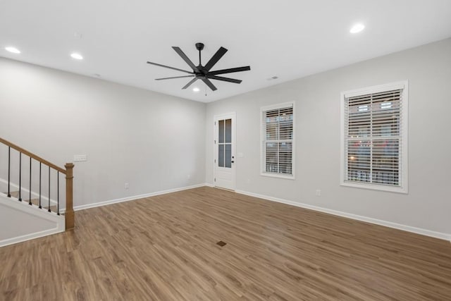 spare room featuring ceiling fan and wood-type flooring