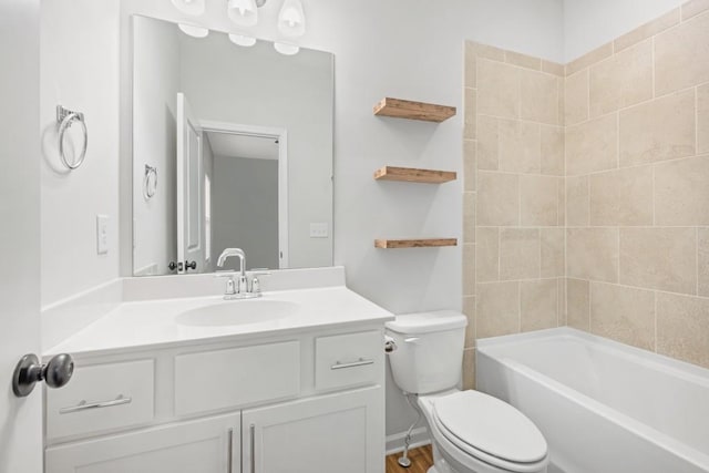 full bathroom with vanity, tiled shower / bath combo, and toilet