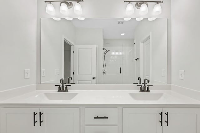 bathroom featuring vanity and walk in shower