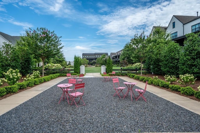 view of property's community with a patio area