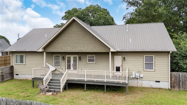 back of property featuring a wooden deck, french doors, a fenced backyard, crawl space, and a yard