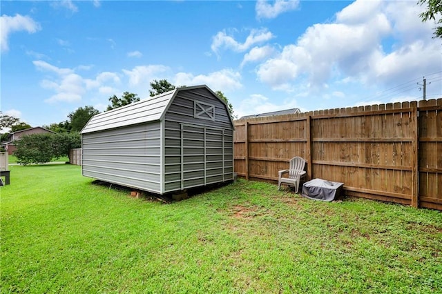 view of shed featuring fence