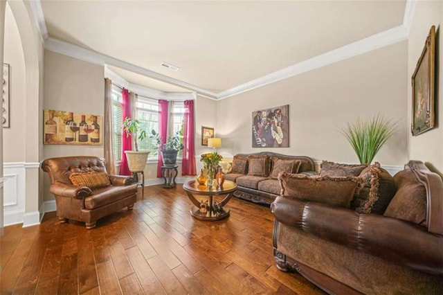 living room featuring hardwood / wood-style floors and ornamental molding