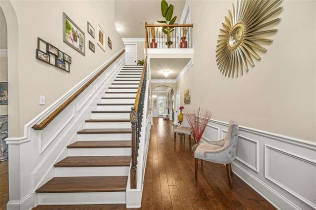 staircase with hardwood / wood-style flooring