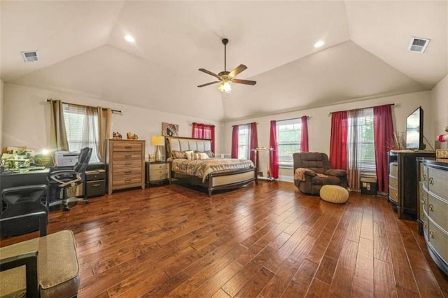 bedroom with ceiling fan, lofted ceiling, and dark hardwood / wood-style floors