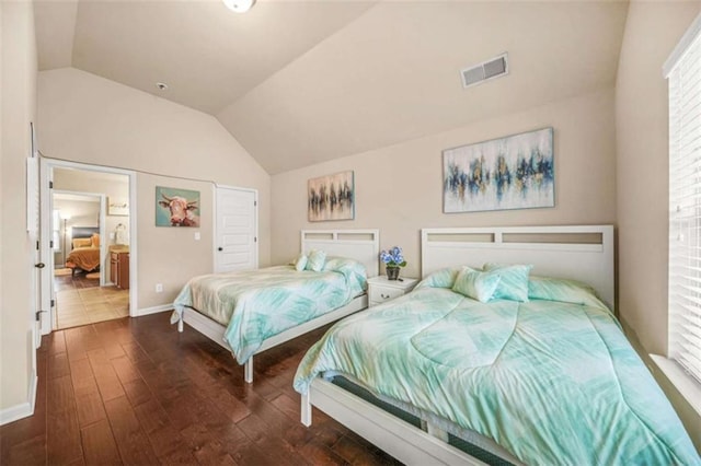 bedroom featuring lofted ceiling, dark hardwood / wood-style flooring, and multiple windows