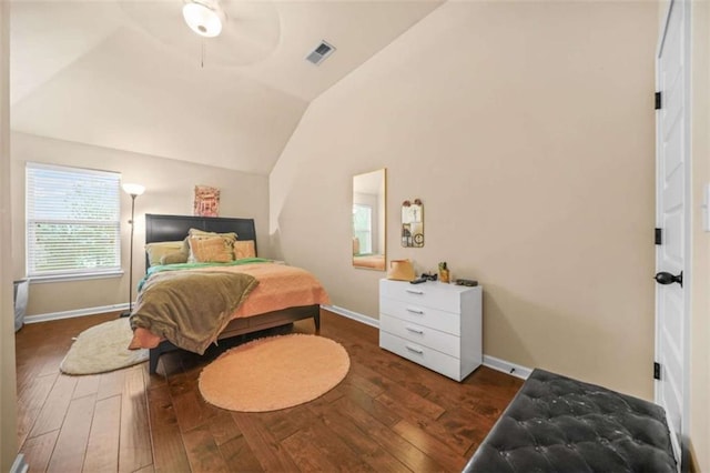 bedroom with vaulted ceiling, dark hardwood / wood-style floors, and ceiling fan