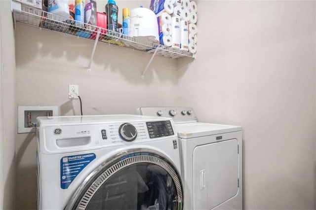 laundry area featuring separate washer and dryer