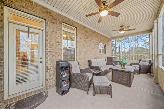 sunroom / solarium with wooden ceiling and ceiling fan