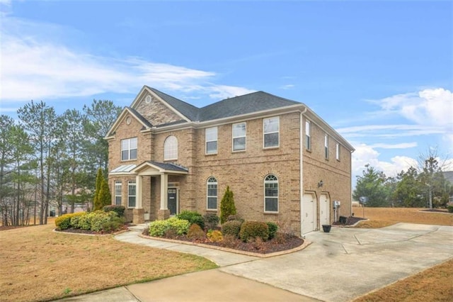 view of front of home with a garage and a front yard