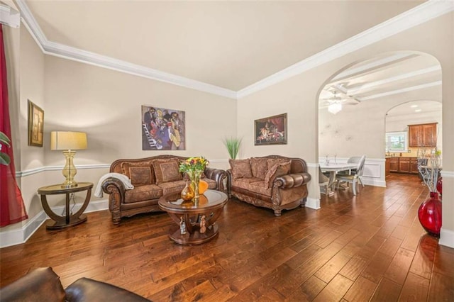 living room with ornamental molding and dark wood-type flooring