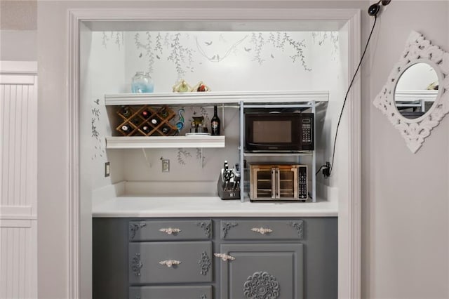 bar with gray cabinetry