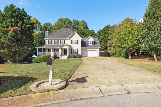 colonial home with a front yard, a porch, and a garage