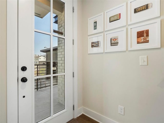 921 Hughley Cir SE Unit 66, Atlanta, GA 30316 - doorway to outside featuring plenty of natural light, baseboards, and dark wood-style floors