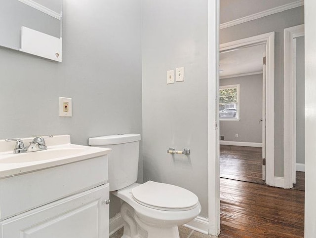 3453 Eisenhower Cir E, Atlanta, GA 30354 - bathroom with ornamental molding, baseboards, hardwood / wood-style floors, toilet, and vanity